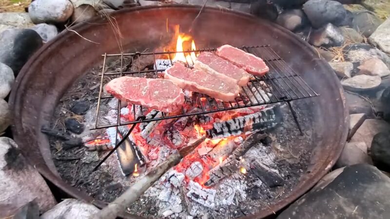 Cooking Steaks on An Open Fire