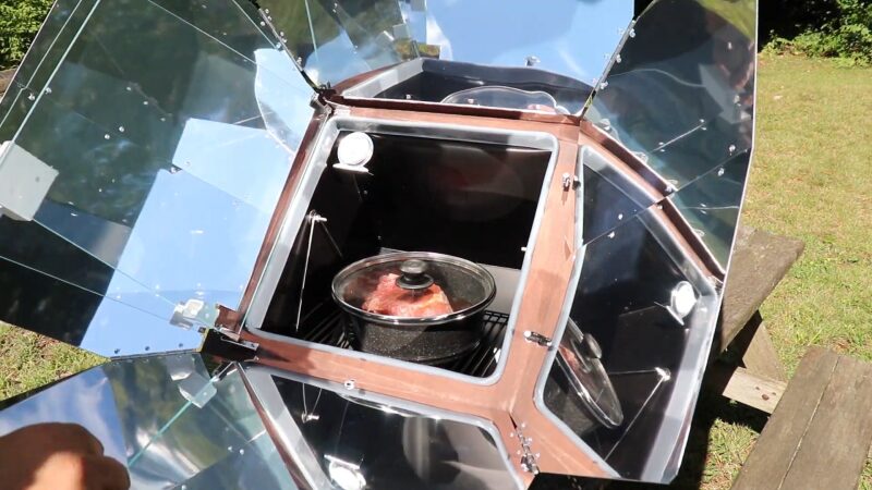 An All American Sun Oven, Angled Towards the Sun, Is Cooking a Meal Outdoors